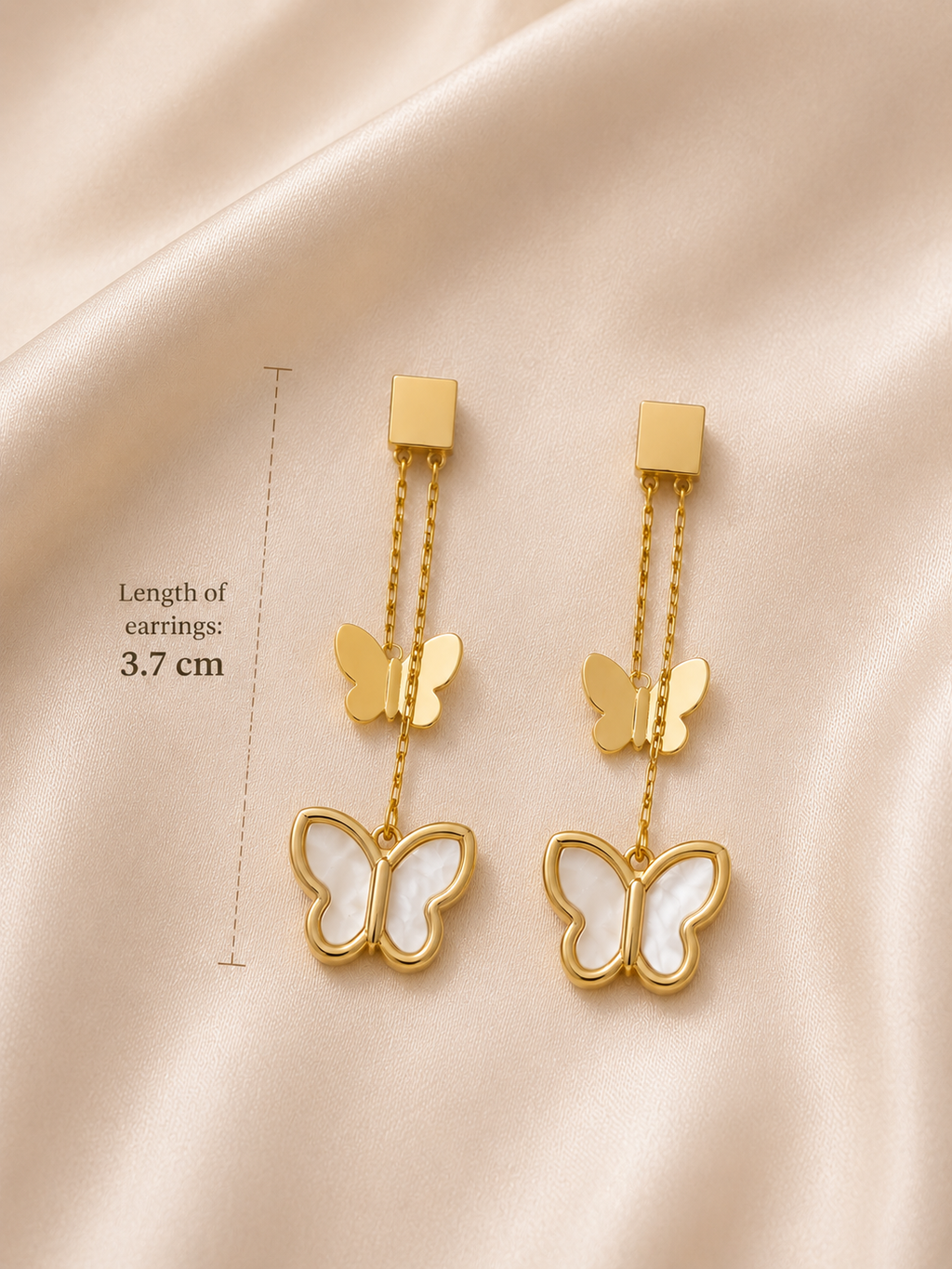 Flutter Bloom Earrings by Ashaarya measuring 3.7 cm in length.butterfly earrings for women, anti tarnish earrings, lightweight earrings, 18kt gold tone earrings, stainless steel earrings, drop earrings for women, elegant butterfly earrings, mother of pearl earrings, skin friendly jewellery, comfort jewellery, premium earrings, Ashaarya earrings