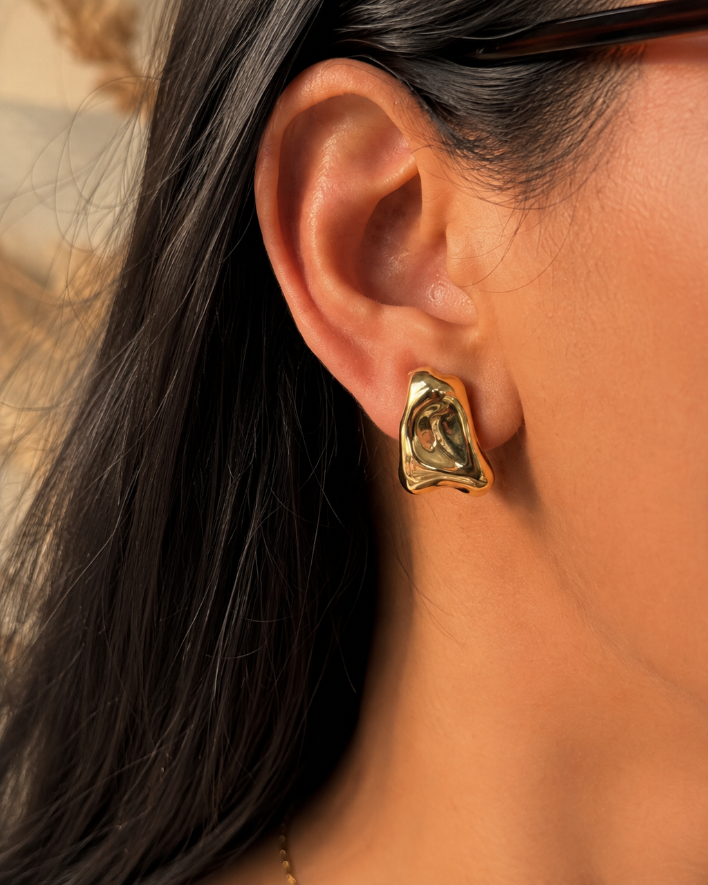 Anti-tarnish chunky gold clip-on earrings with a smooth sculptural finish and secure clip-on fastening for women