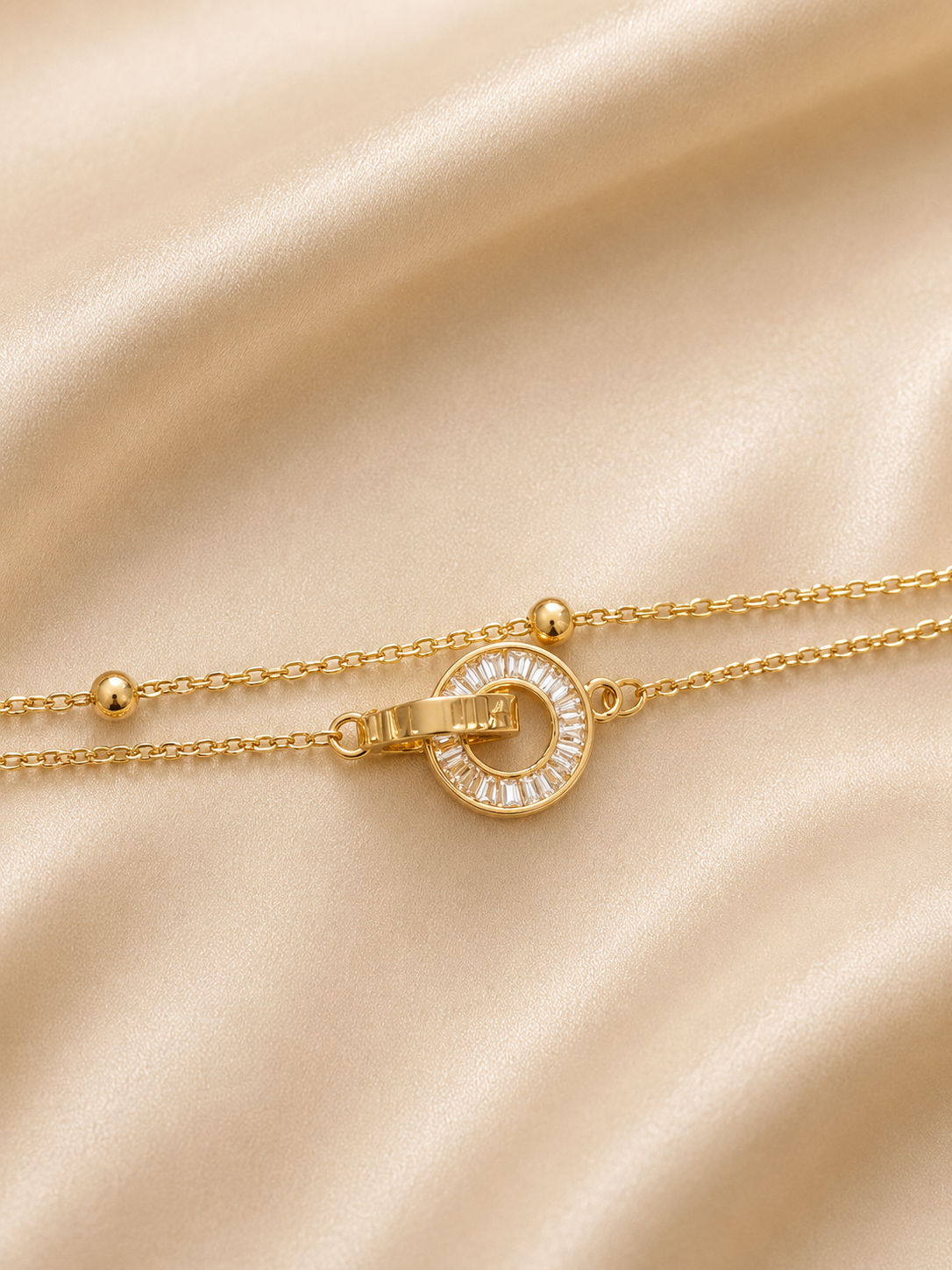 Linked in Light anti-tarnish gold bracelet for women with interlocking circular motif and baguette-cut stones by Ashaarya