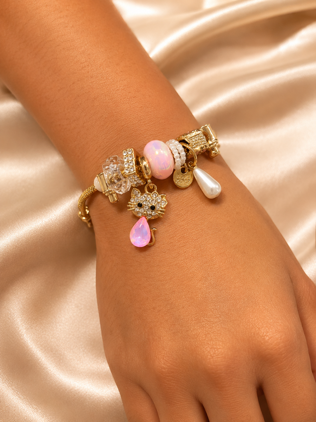 cat charm bracelet, cute charm bracelet, gold charm bracelet for women, anti tarnish charm bracelet, 316L stainless steel bracelet, lightweight bracelet, pink charm bracelet, comfort jewellery, Ashaarya charm bracelet