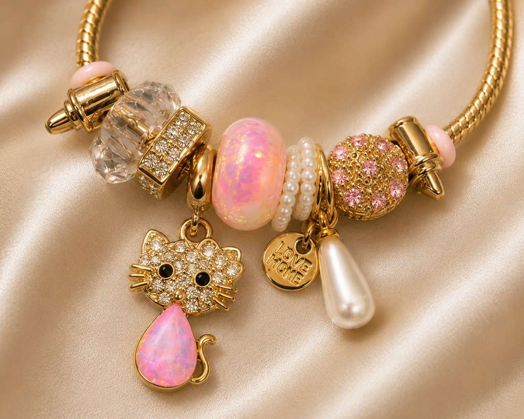 Kitty Keepsake Charm Bracelet by Ashaarya worn on a wheatish Indian model hand. cat charm bracelet, cute charm bracelet, gold charm bracelet for women, anti tarnish charm bracelet, 316L stainless steel bracelet, lightweight bracelet, pink charm bracelet, comfort jewellery, Ashaarya charm bracelet