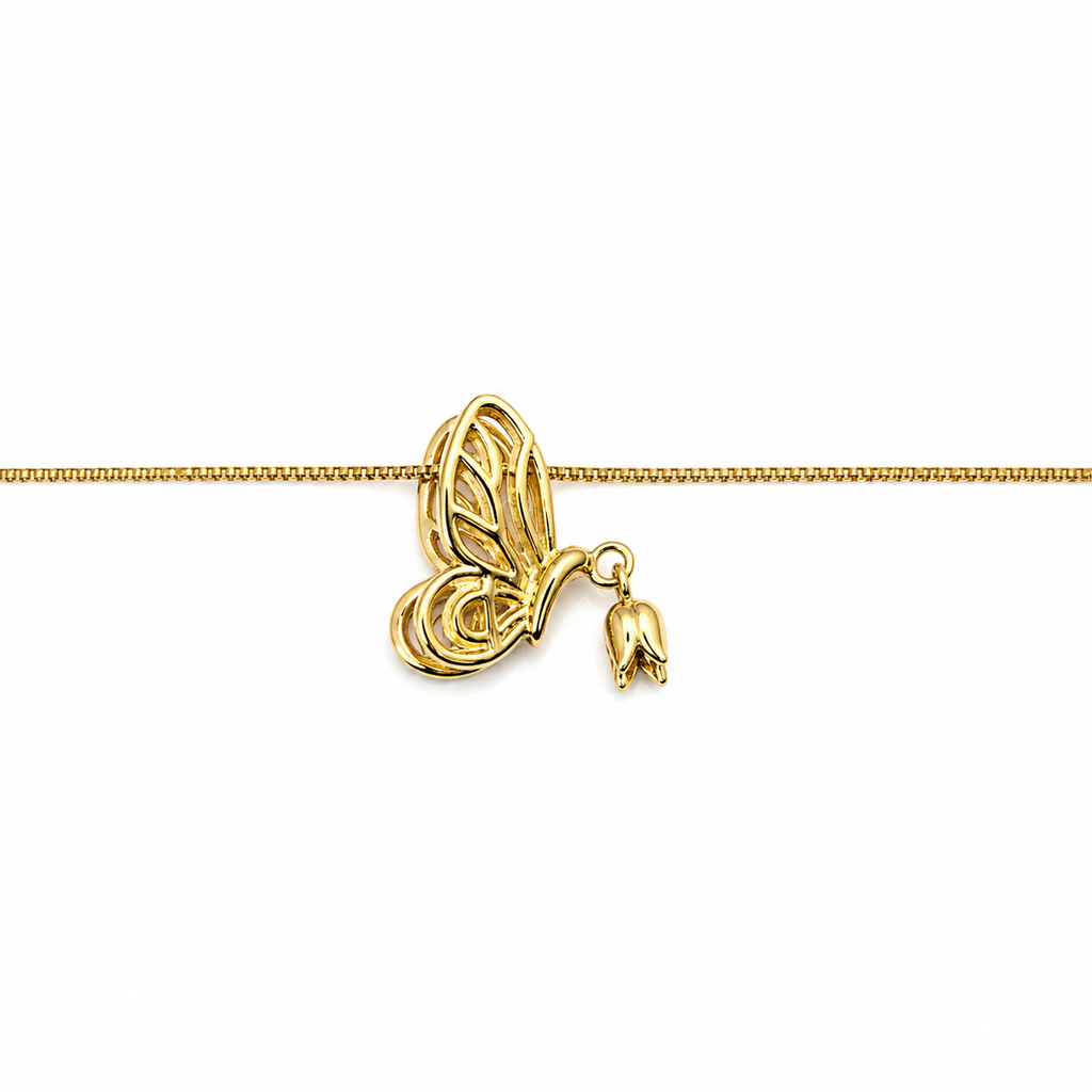 Lightweight gold butterfly pendant necklace worn by a woman for an elegant minimalist jewellery look