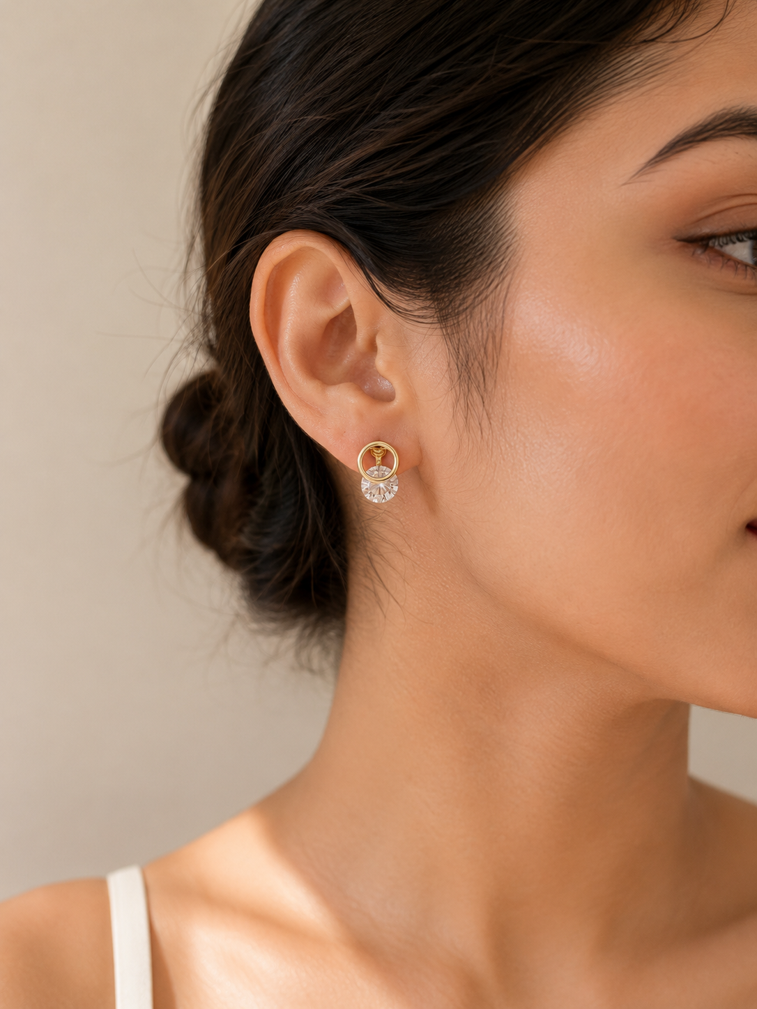 Lightweight gold clip-on earrings for women featuring sparkling crystal discs and a comfortable no-piercing design
