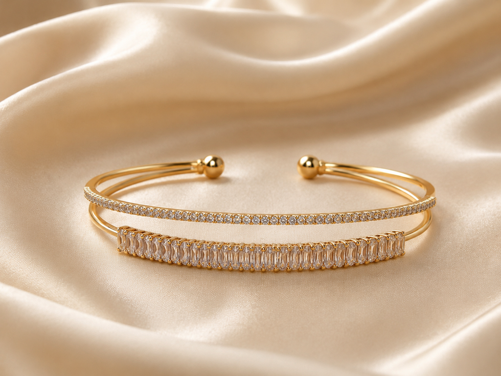 Lightweight gold crystal bracelet designed as comfort jewellery, featuring an open cuff silhouette and sparkling stone detailing