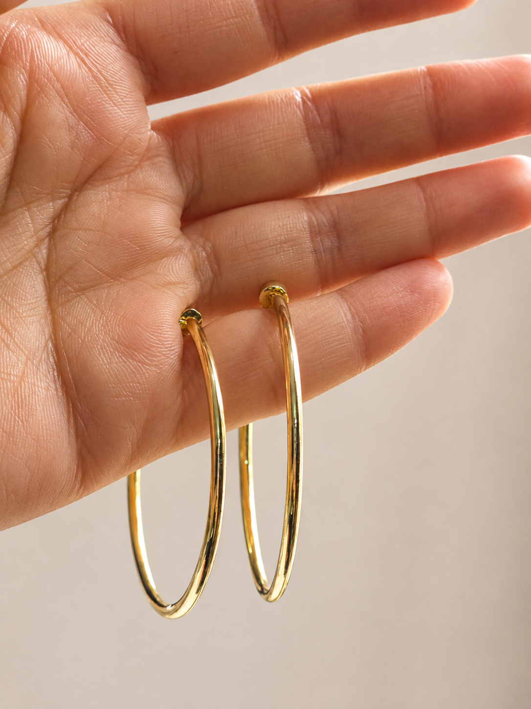 Lightweight gold hoop earrings for everyday wear, designed as anti-tarnish comfort jewellery for women by Ashaarya.