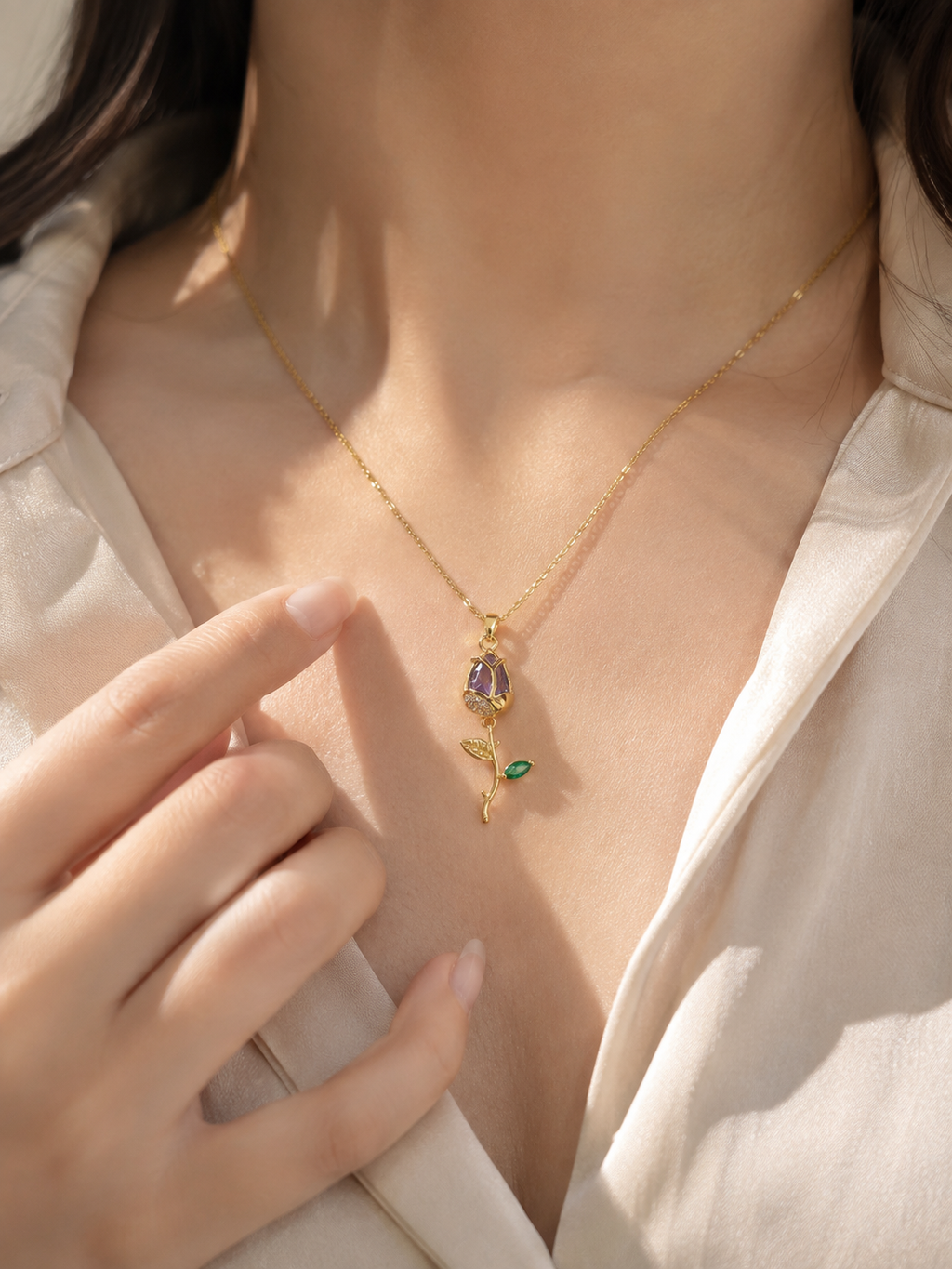 Lightweight purple stone necklace designed as comfort jewellery with a delicate gold-tone chain and elegant botanical gemstone pendant