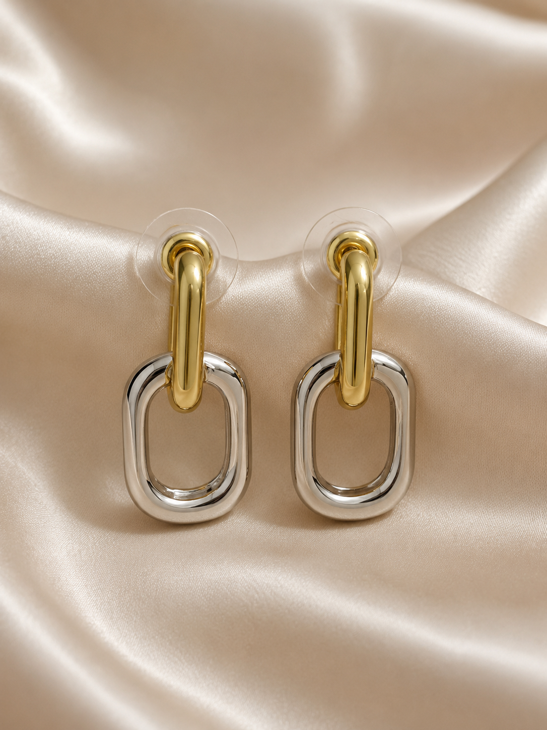 Luna Link two-tone gold and silver stainless steel link earrings by Ashaarya. two tone earrings, gold and silver earrings, stainless steel earrings, anti tarnish earrings, lightweight earrings, statement earrings for women, geometric earrings, modern earrings, link earrings, everyday earrings, skin friendly jewellery, comfort jewellery