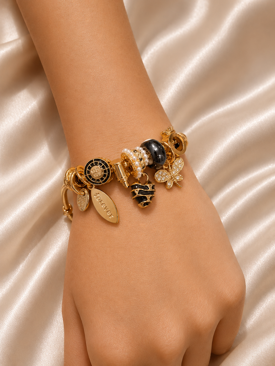 charm bracelet, black charm bracelet, butterfly charm bracelet, gold charm bracelet for women, anti tarnish jewellery, 316L stainless steel jewellery, lightweight bracelet, skin friendly jewellery, adjustable bracelet, everyday bracelet, demi fine jewellery, statement charm bracelet, luxury charm bracelet, comfort jewellery, Ashaarya charm bracelet