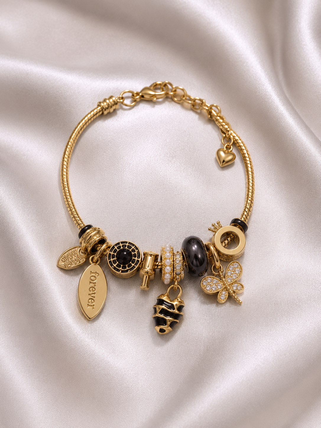 Detailed view of Midnight Monarch Charm Bracelet by Ashaarya, lightweight anti-tarnish comfort jewellery.. charm bracelet, black charm bracelet, butterfly charm bracelet, gold charm bracelet for women, anti tarnish jewellery, 316L stainless steel jewellery, lightweight bracelet, skin friendly jewellery, adjustable bracelet, everyday bracelet, demi fine jewellery, statement charm bracelet, luxury charm bracelet, comfort jewellery, Ashaarya charm bracelet