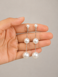 Pearl Cascade Drop Earrings by Ashaarya featuring three white pearl accents and delicate silver-tone chains.