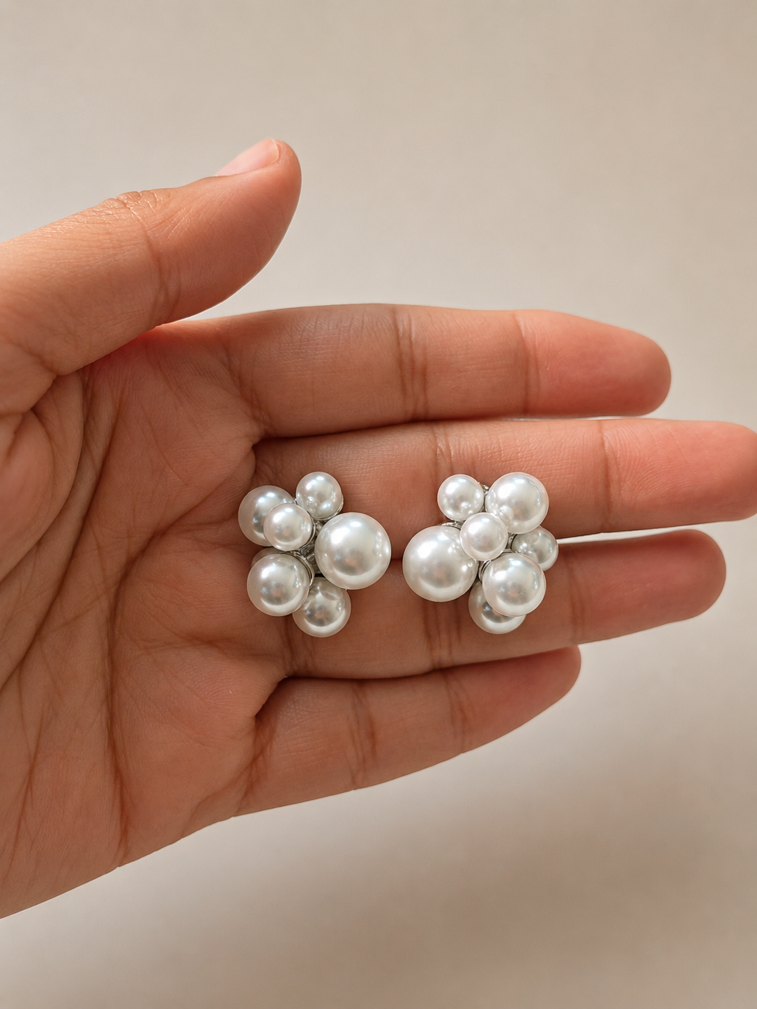 Pearl clip-on earrings with a no-piercing design, featuring multiple white pearls for a sophisticated feminine look