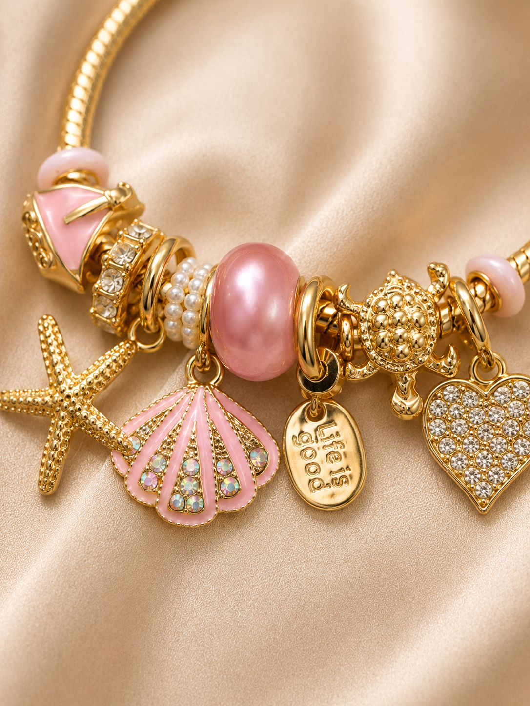 pink charm bracelet, ocean charm bracelet, beach charm bracelet, gold charm bracelet for women, seashell charm bracelet, turtle charm bracelet, 18KT gold plated bracelet, anti tarnish bracelet, stainless steel charm bracelet, lightweight charm bracelet, hypoallergenic bracelet, aesthetic charm bracelet, vacation jewellery, women's charm bracelet, Ashaarya charm bracelet
