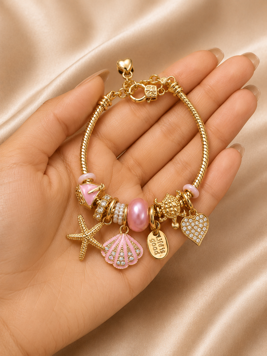 pink charm bracelet, ocean charm bracelet, beach charm bracelet, gold charm bracelet for women, seashell charm bracelet, turtle charm bracelet, 18KT gold plated bracelet, anti tarnish bracelet, stainless steel charm bracelet, lightweight charm bracelet, hypoallergenic bracelet, aesthetic charm bracelet, vacation jewellery, women's charm bracelet, Ashaarya charm bracelet