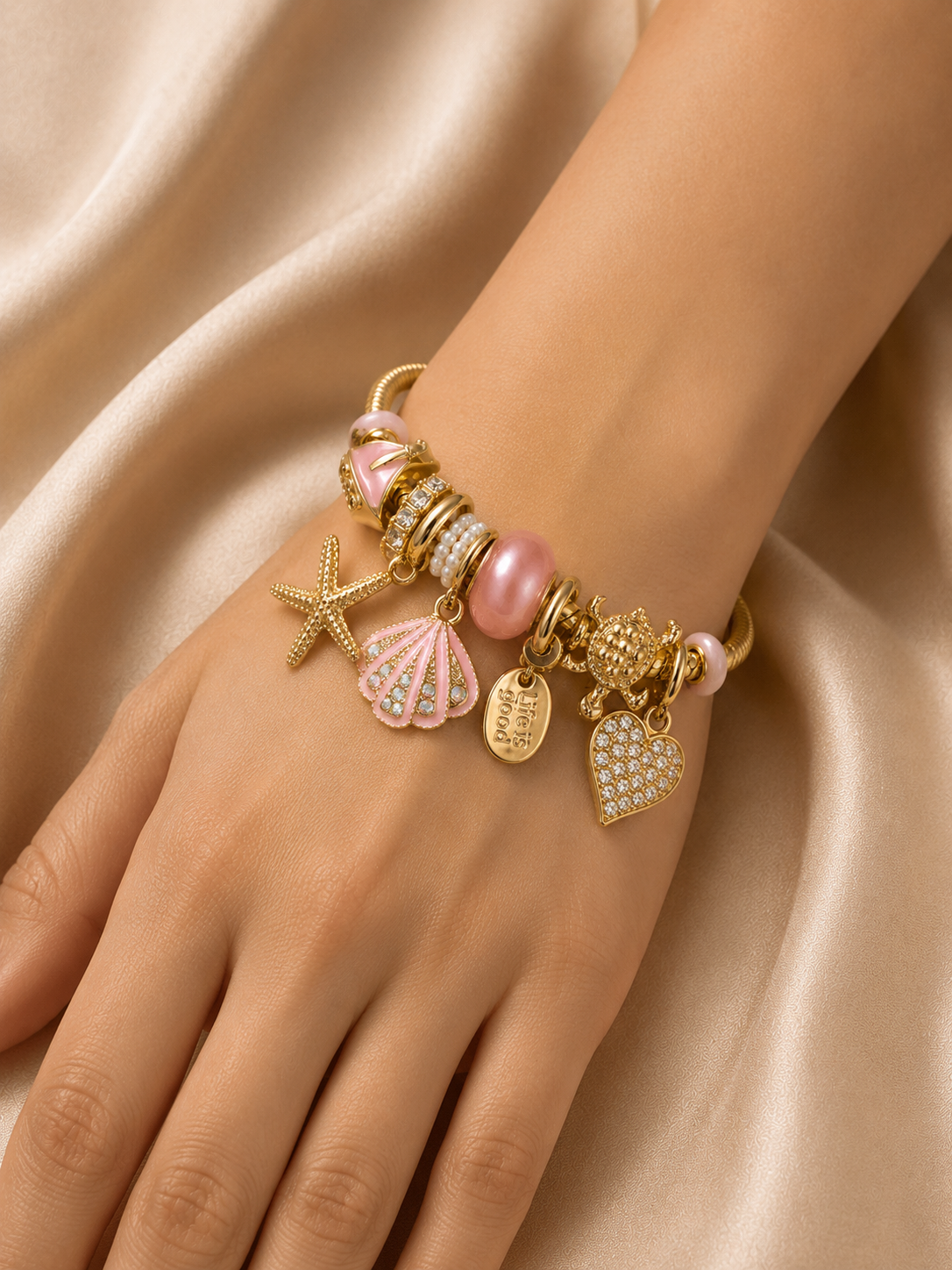 pink charm bracelet, ocean charm bracelet, beach charm bracelet, gold charm bracelet for women, seashell charm bracelet, turtle charm bracelet, 18KT gold plated bracelet, anti tarnish bracelet, stainless steel charm bracelet, lightweight charm bracelet, hypoallergenic bracelet, aesthetic charm bracelet, vacation jewellery, women's charm bracelet, Ashaarya charm bracelet