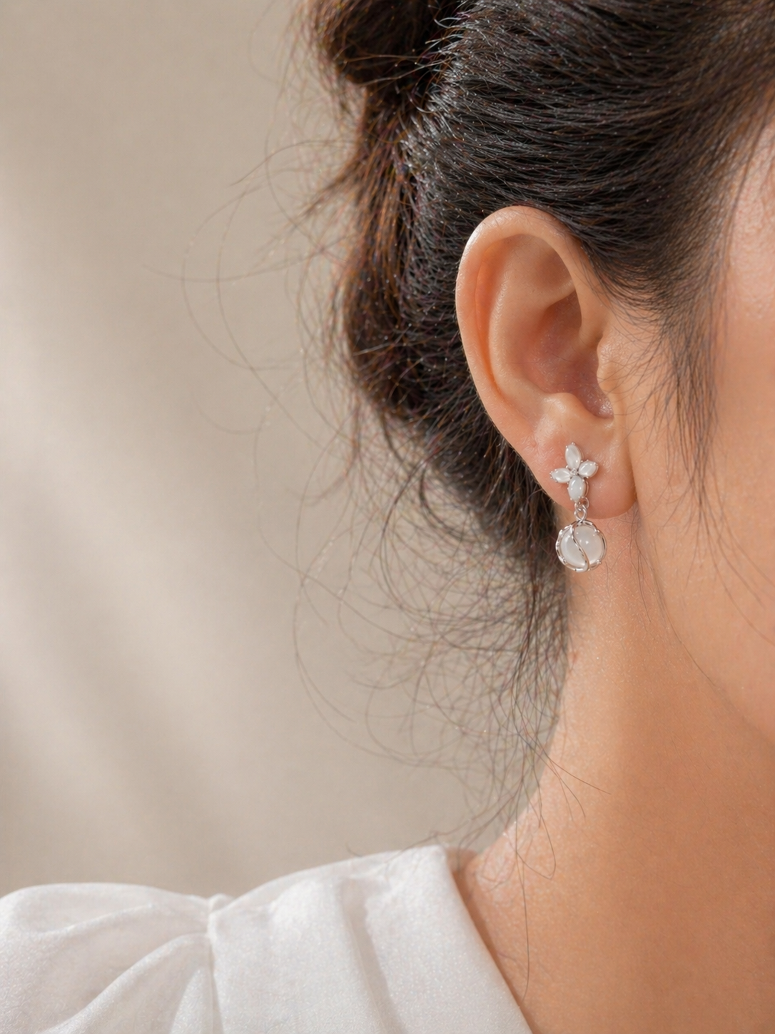 Model wearing Noctra star clip-on earrings, lightweight dangling clip-on earrings for women, anti-tarnish comfort jewellery by Ashaarya