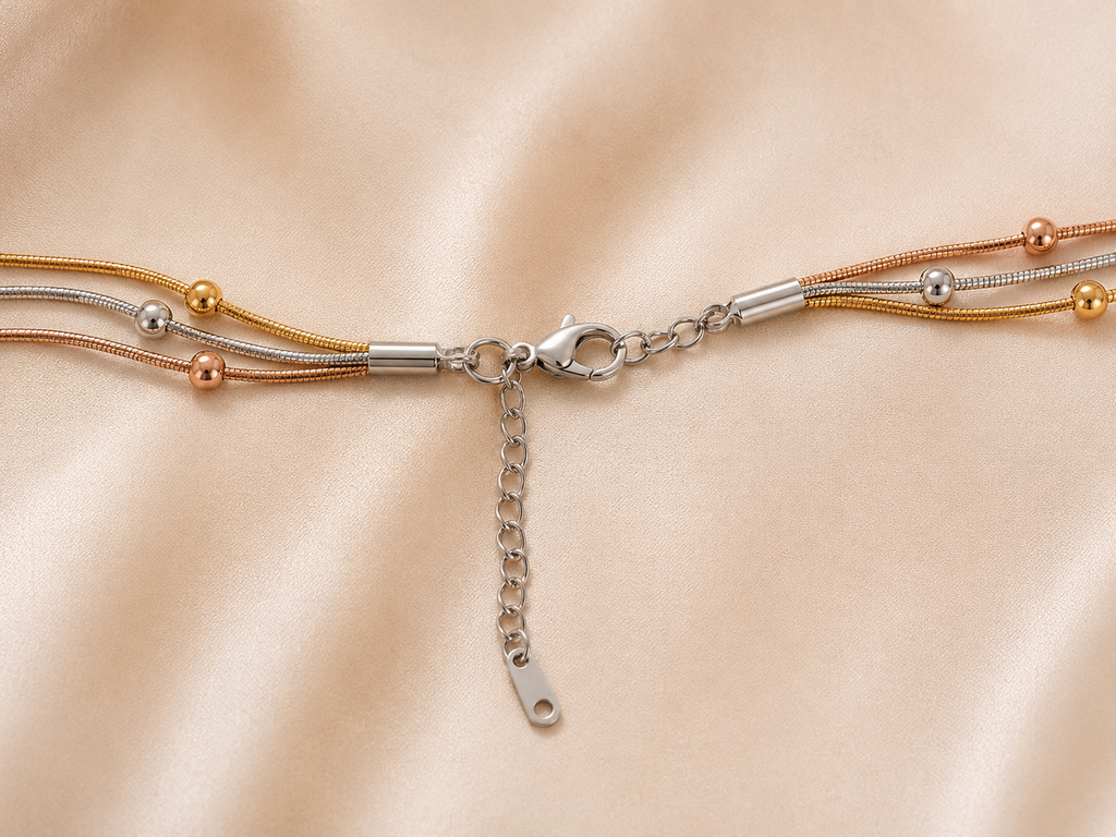 Trio Harmony Necklace by Ashaarya featuring 18KT gold tone, silver tone and rose gold tone layered beaded chains crafted in anti-tarnish 316L stainless steel.