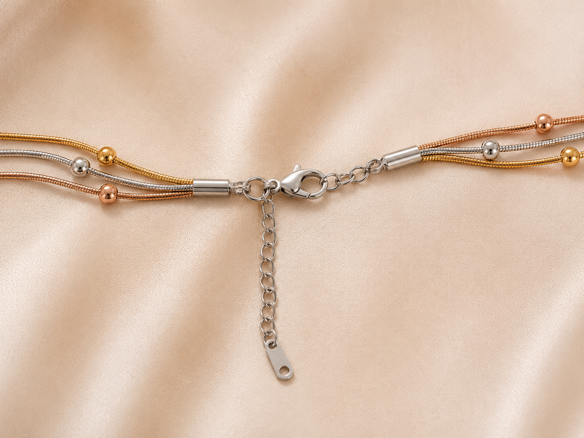 Trio Harmony Necklace by Ashaarya featuring 18KT gold tone, silver tone and rose gold tone layered beaded chains crafted in anti-tarnish 316L stainless steel.
