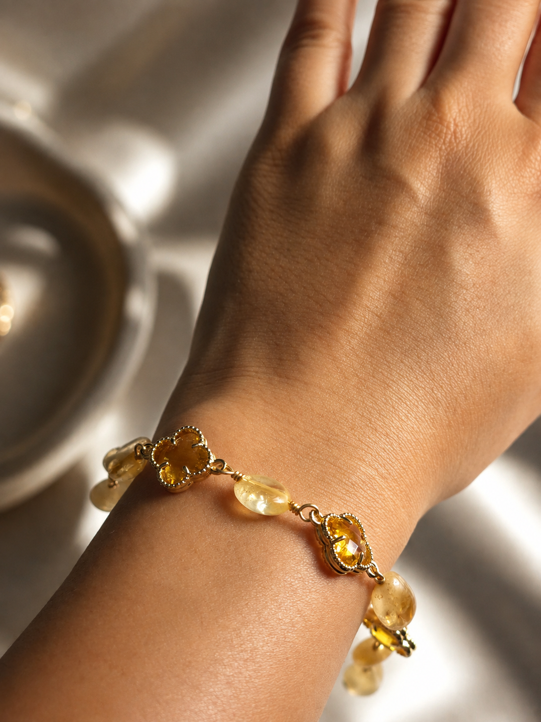 Yellow gemstone bracelet for women featuring natural stone beads, sparkling floral accents and a refined demi-fine jewellery design